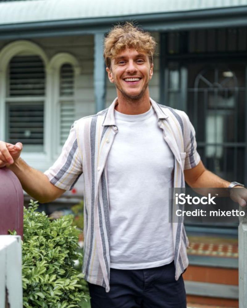 guy in front of house